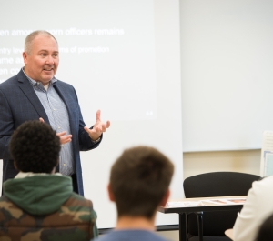 Professor Sobol lectures in front of class